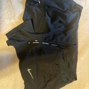 Black Nike running shorts